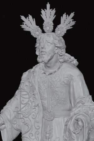 Religious statue of a bearded man in ornate embroidered robes with outstretched arms and a radiant crown above his head.